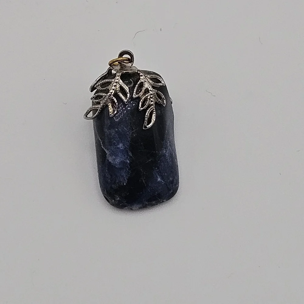 sodalite blue stone pendant with silver tone leafy bail